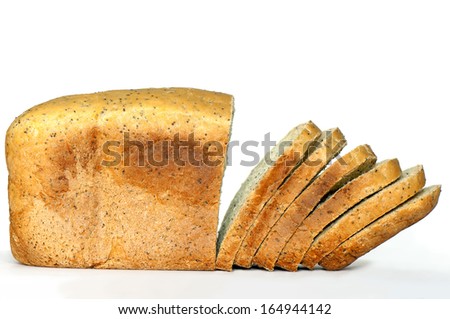 Sliced fresh homemade poppy seed bread with turmeric on white background