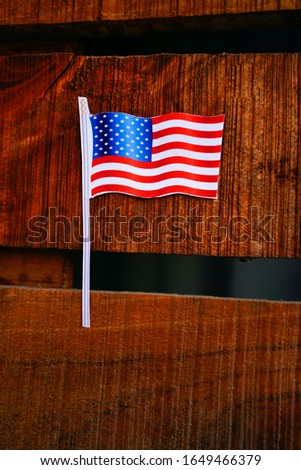 Concept of president day, American flag on wooden background 
