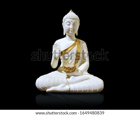 Marble White Statue of Buddha isolated on Black background Royalty-Free Stock Photo #1649480839
