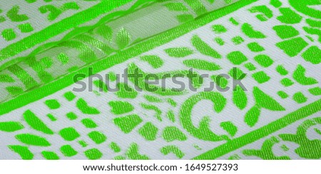 Texture, pattern, collection, silk fabric, female scarf, green emerald pastel on a beige background