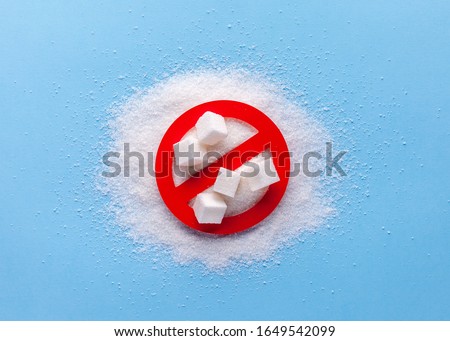 Harm from sugar concept. Food and diet concept. No sugar. Diabetes concept. Blue background. Royalty-Free Stock Photo #1649542099
