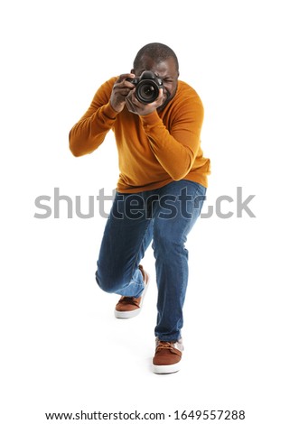 African-American photographer on white background