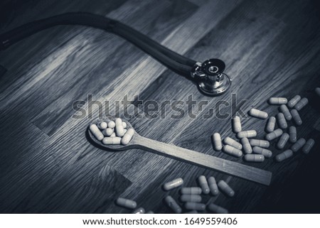 Health concept. Stethoscope and Tablet on wooden doctor table