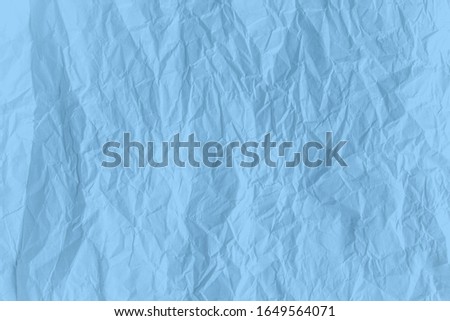 Surface Blue color crumpled paper close up texture background
