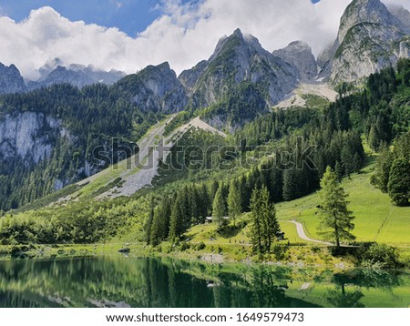 Austrian alpine lake . Summer day .