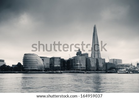Urban architecture over Thames River in London in black and white.