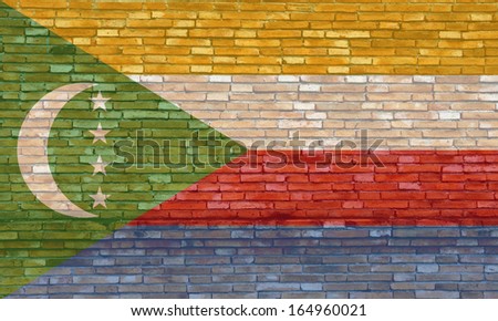 Comoros flag on texture brick wall. 