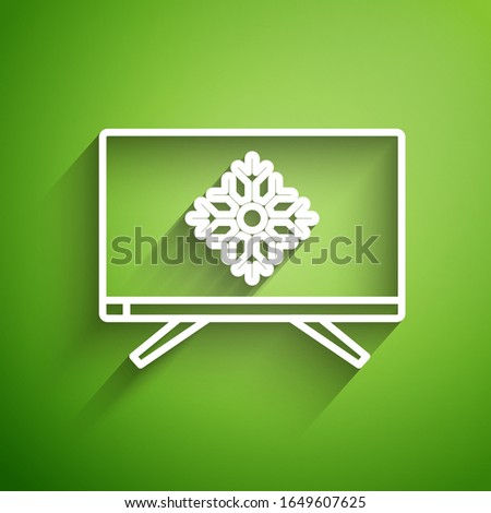 White line Merry Christmas on television and snowflake icon isolated on green background. Happy New Year.  Vector Illustration