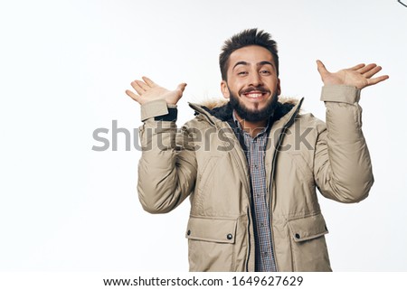 young man in warm clothes isolated background