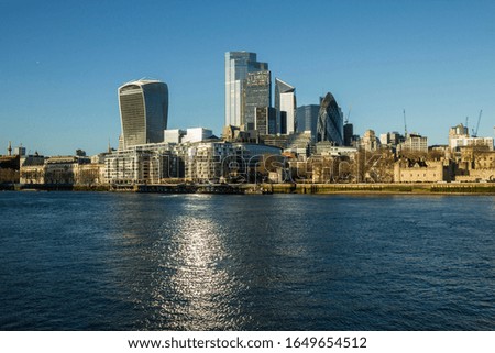 London city towers, view from Thames river bank