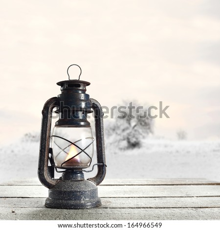 white table with oil lamp and landscape 
