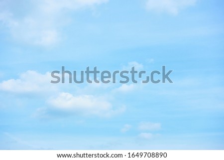 Pastel blue sky with clouds - abstract background