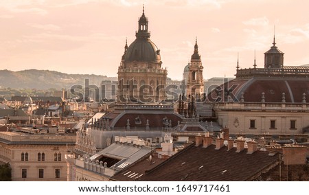 Romantic morning lights in the old town of Budapest. Rooftop view of the Andrassy Avenue, towers of the St. Stephen Basilica, the Opera the Royal Palace in Hungary, Europe. Royalty-Free Stock Photo #1649717461