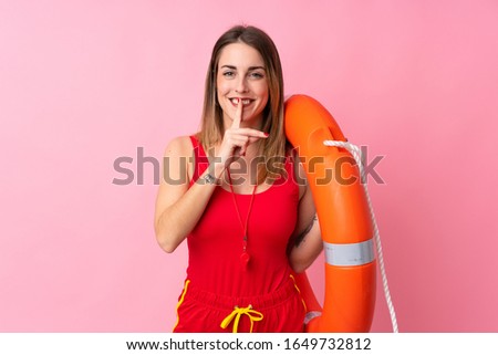 Lifeguard woman over isolated background doing silence gesture