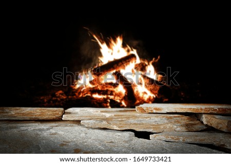 campfire background and free space for your product on stones.Copy space for your product and dark mood photo of night. 