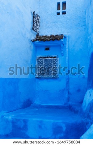 Typical beautiful moroccan architecture streets and different exotic doors in Chefchaouen blue city Medina in Morocco