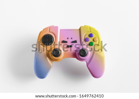 Rainbow  wireless gamepad for playing video games. Joystick or game controller on a white background. Copy space for text Royalty-Free Stock Photo #1649762410