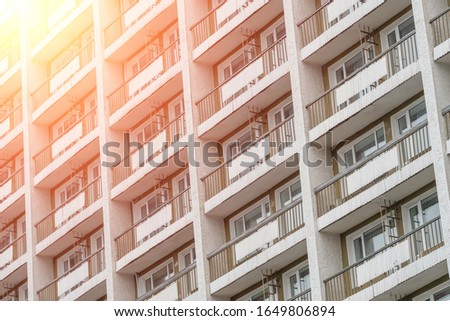 Balconies of a multi-storey residential building. urban background. Photo with illumination
