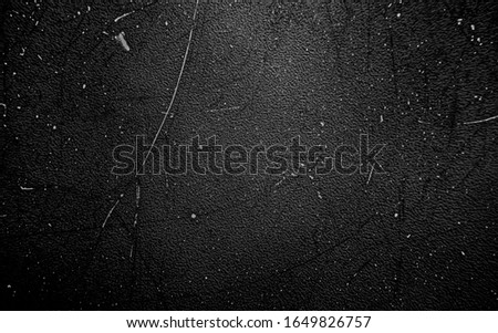 Scratchy noisy grainy surface as old retro vintage texture black background backdrop