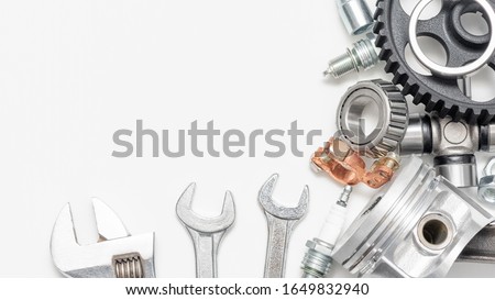 Auto service business card with copy space. Car spare parts on white background. 