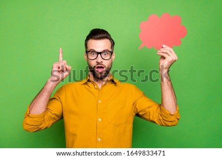 Portrait of nice attractive amazed intellectual guy in formal shirt holding in hand red empty blank card found solution pointing up isolated on bright vivid shine vibrant green color background Royalty-Free Stock Photo #1649833471