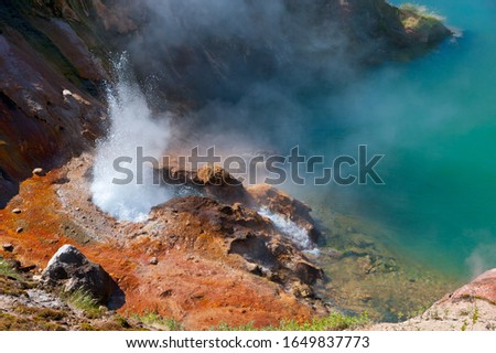 The eruption of a geyser in "Valley of geysers", Kamchatka.  Royalty-Free Stock Photo #1649837773