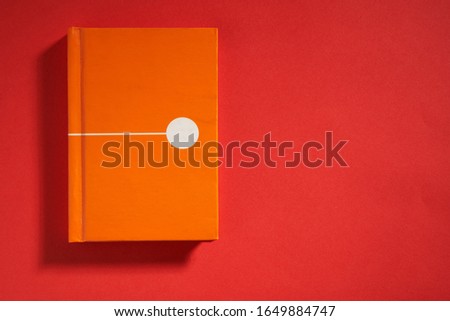 blank notepad on the red background