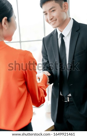 Business people shaking hands after meeting
