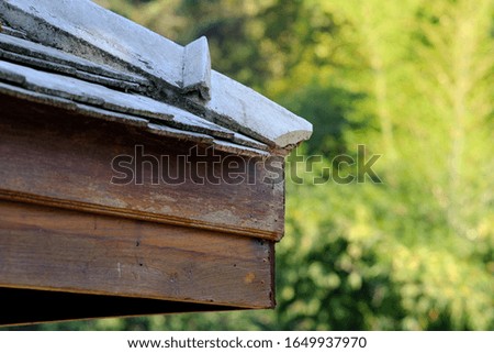 The eaves make by wood and blur background