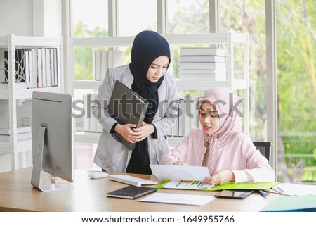 Muslim women and modern business professionals

