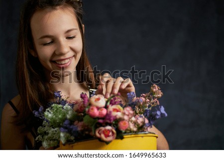 
girl with flowers on a black background