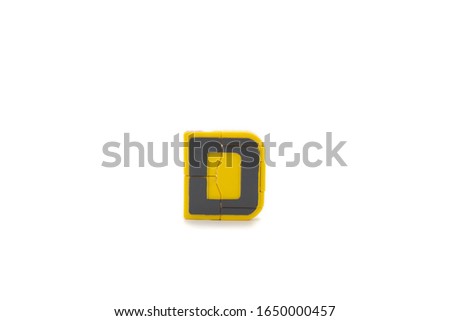 isolated plastic toy "D" letter in studio light on white background.