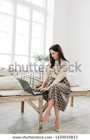 girl works at the computer in the office