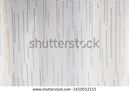 
shaped patterns on white curtains