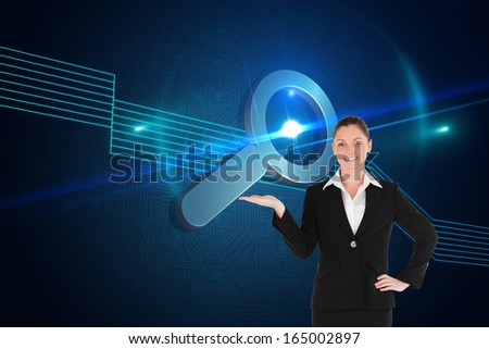 Composite image of charming woman in suit showing a copy space while standing