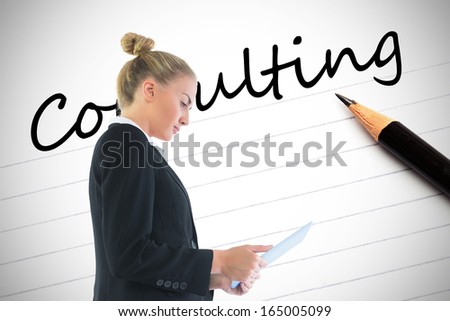 Composite image of blond businesswoman holding tablet