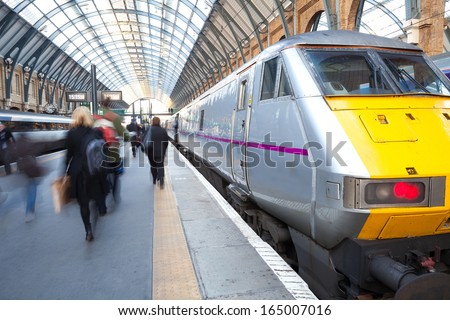 London Train Tube station Blur people movement in rush hour at King's Cross station, England, UK  Royalty-Free Stock Photo #165007016