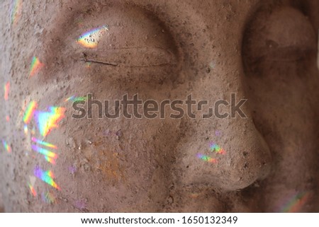 buddha statue rainbow spectrum of light