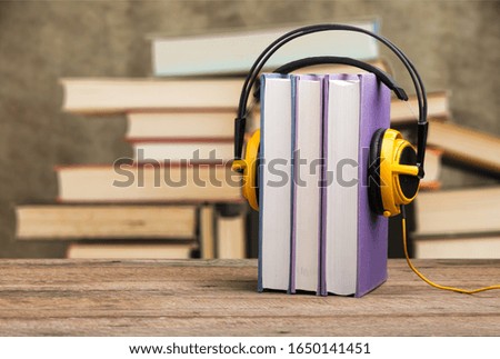 Study book with headphones, audio book concept