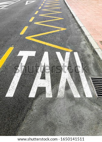 Closeup photo of special lane for taxi painted on the road