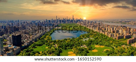 Aerial view of Manhattan New York looking south up Central Park during epic sunset over the city. Royalty-Free Stock Photo #1650152590