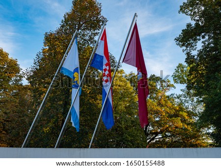Croatia Flag with regional flags on display near Plitvice Lakes