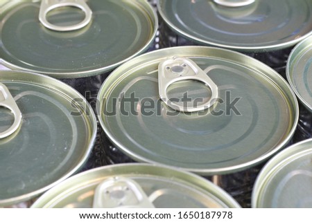 Top of metal cans with ring for opening.
