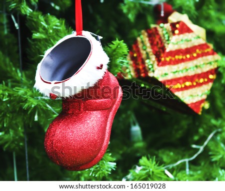 Gift present and ornament on Christmas tree