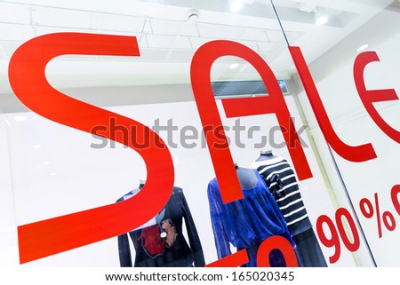 sale word with shop window