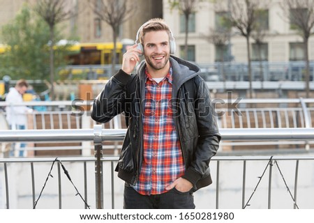 Self improve. Handsome man enjoy music urban background. Distance education. Remote studying. Modern education. Podcast for youth. Online education courses. Listen music. Student study use headphones.