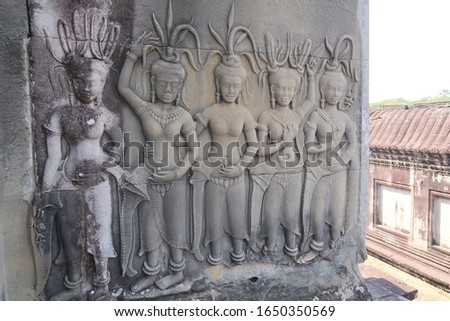 detailed picture of four well preserved shiva, hindu, religon murals, bas relief and one damaged, angkor wat