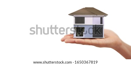 House Residential Structure in a hand ,business home idea
