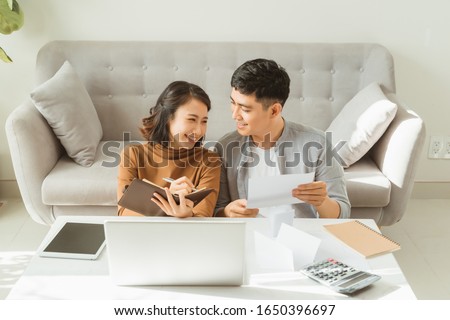 Young Asian man and woman stress with her business online shopping at office. Royalty-Free Stock Photo #1650396697