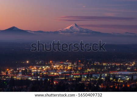 Bend Oregon cityscape with Mt Jefferson at sunset Royalty-Free Stock Photo #1650409732